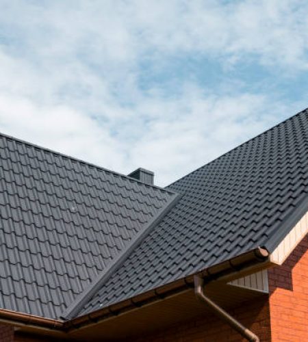 Modern roof covered with tile effect PVC coated brown metal roof sheets